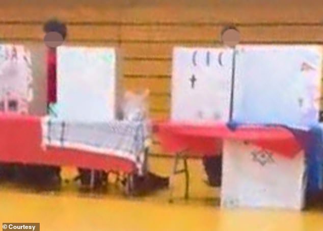 Video capture showing the Muslim Student Union table with the keffiyeh, but the Jewish Student Union table had to remove the Israeli flag and yellow tape.