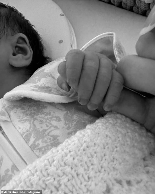 The Manchester City footballer shared an adorable black and white photo of his newborn baby girl holding his finger.