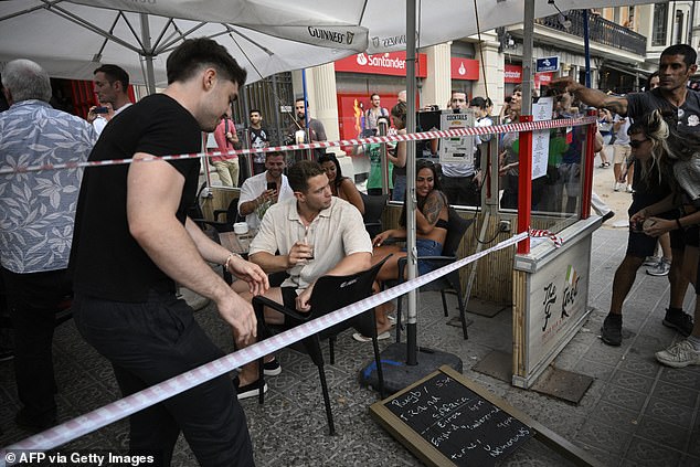 A symbolic cordon was placed around a bar-restaurant in an area popular with tourists during the Barcelona protest in July.