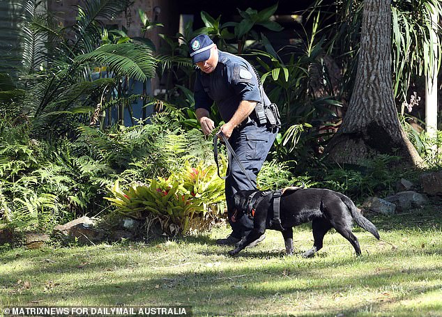 Police are seen supervising bush clearing in the nearby town of Kendall in a search for William in 2021.