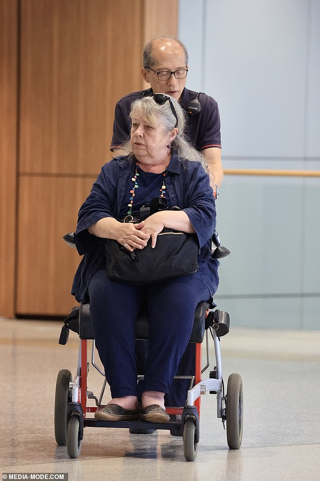 The Australian actress, 71, was transported through the airport by airline staff after disembarking from the plane.