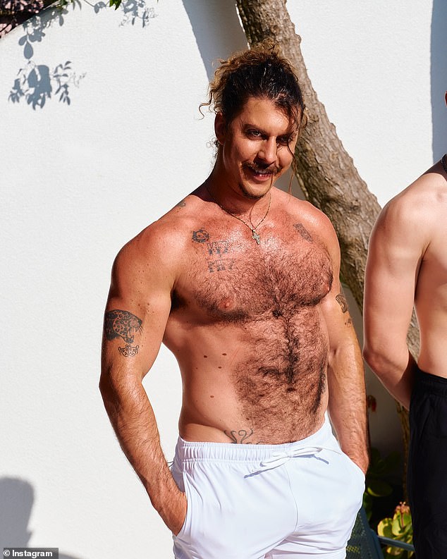 Adam flaunted his hirsute torso as he took off his jacket.