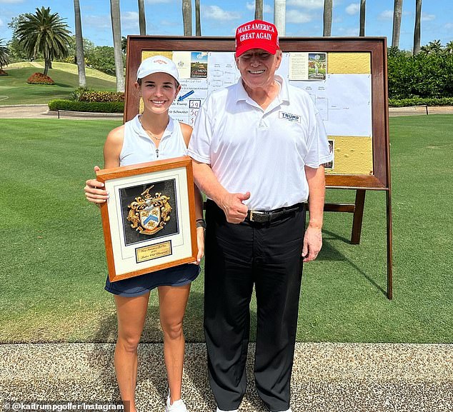 Kai posed with his grandfather, Donald Trump, with an award he won for playing golf