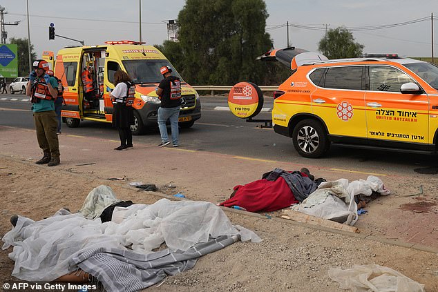 The bodies of civilians killed in a Palestinian militant attack lie covered in the southern Israeli town of Sderot on October 7, 2023.