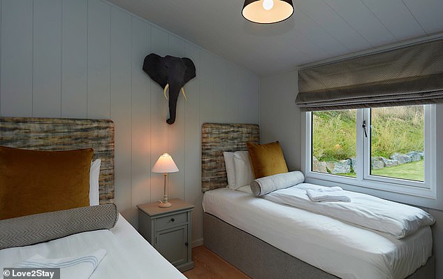 Shown here is the second bedroom with two single beds.