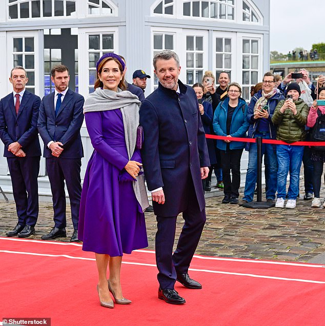 The only pieces of jewelry Mary wore were her wedding ring and a pair of diamond earrings, as Mary joined Frederik in posing for photos together.