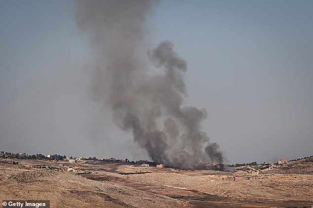 Smoke rises from a village across the border in Lebanon following an Israeli air force strike on October 4, 2024 in Rihaniya, Israel.