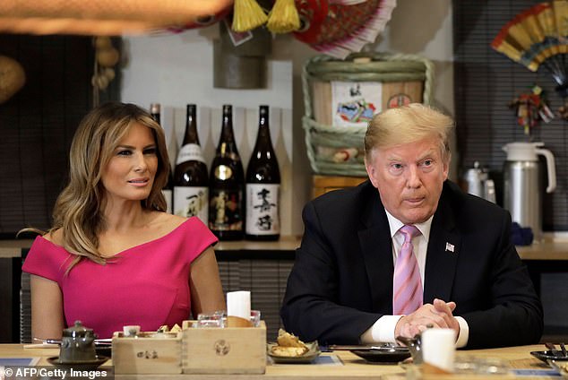 Donald and Melania Trump attend a dinner with Japanese Prime Minister Shinzo Abe and his wife Akie Abe at the Inakaya restaurant in Tokyo's Roppongi district during their visit in May 2019.