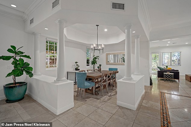 The open floor plan connects a large living room and dining room with a stellar kitchen.