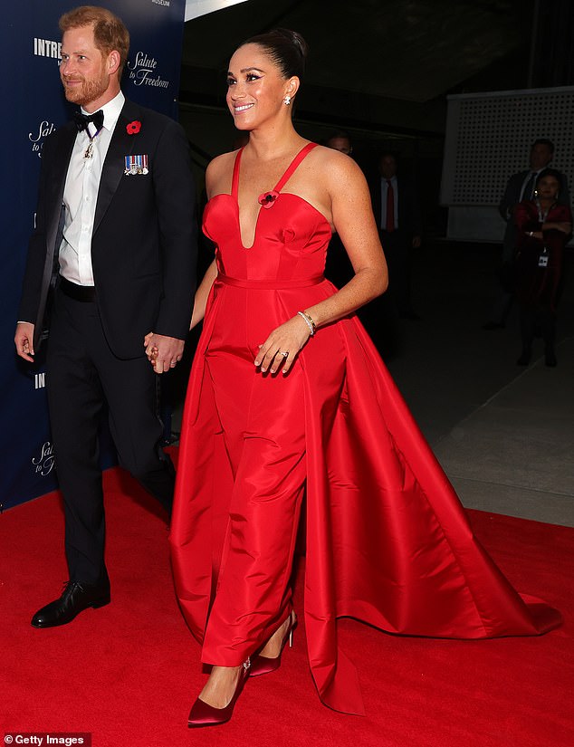 Sporting her original train and showing less flesh (plus a tighter shiny hairstyle), the Duchess of Sussex epitomized the look when she wore the same dress in 2021.