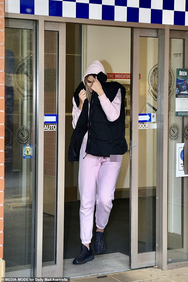 Sarah was seen leaving Kogarah police station in Sydney's southern suburbs last Wednesday afternoon, shielding her face with her jacket.