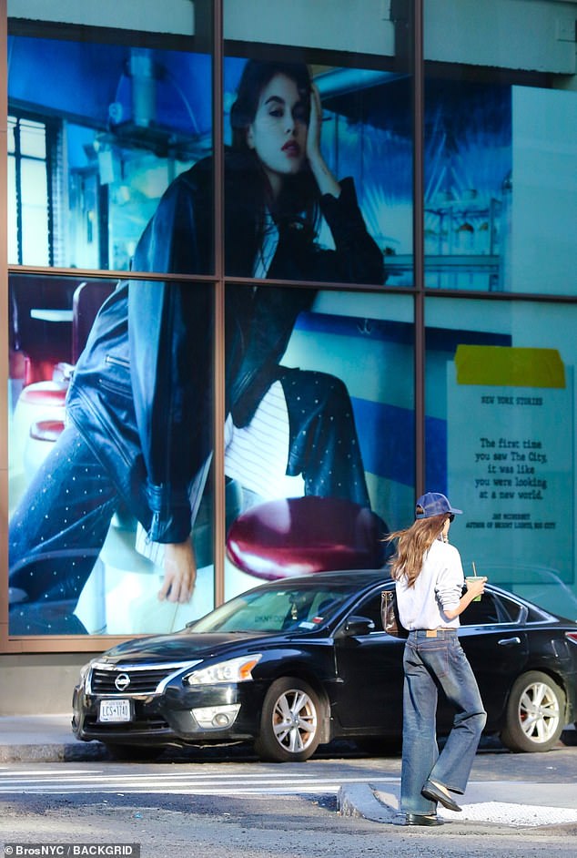 Kaia showed off ultimate It-girl status as she walked past a huge billboard of herself while carrying a drink. The ad was for DKNY.