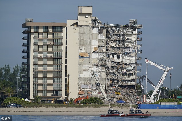 Pictured: The Champlain Tower South after its collapse on July 1, 2021