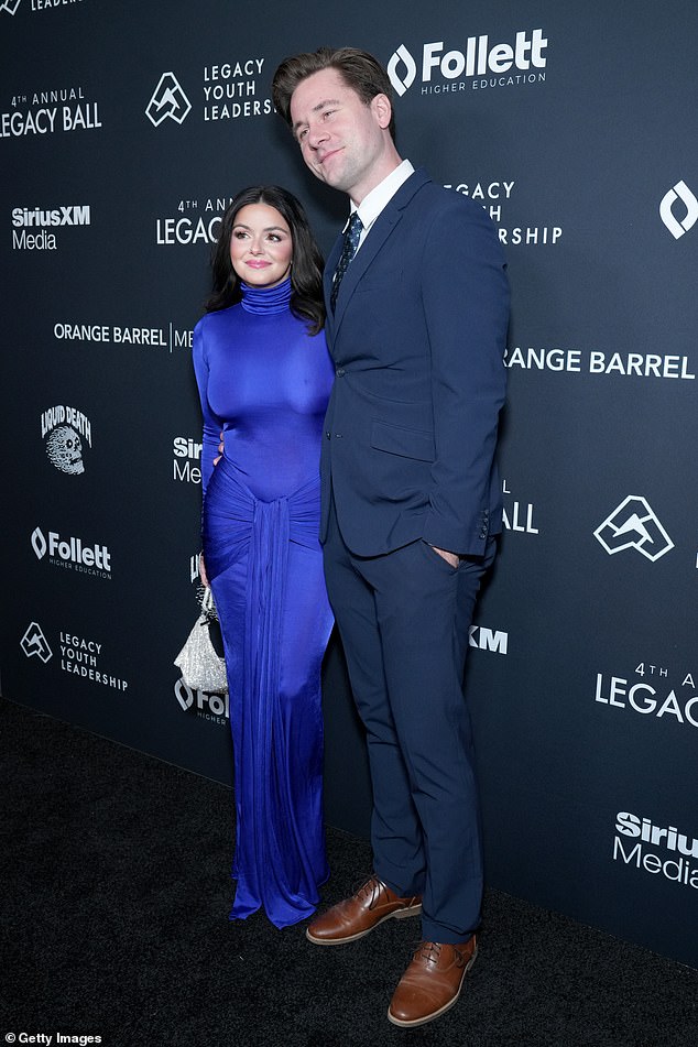 The little stunner did her makeup perfectly with a pink lip while holding a silver purse while adding high heels.