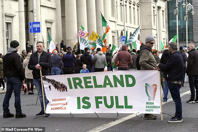 Protesters take part in the Ireland Says No anti-refugee rally outside Customs in Dublin, March 22, 2024.