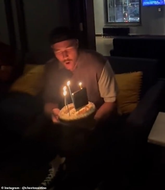 Santino also captured the moment he brought out a birthday cake for Kelce that night.