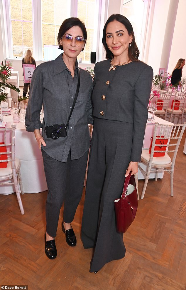 Lauren posed with Paul McCartney's daughter Mary, 55, during the event, who also wore an all-grey suit.