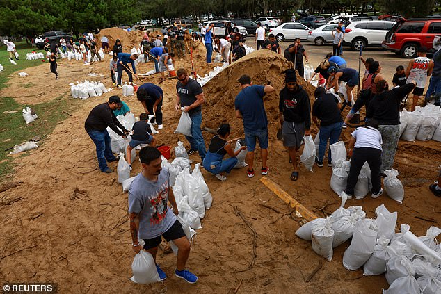 People prepare sandbags before Hurricane Milton arrives in Orlando