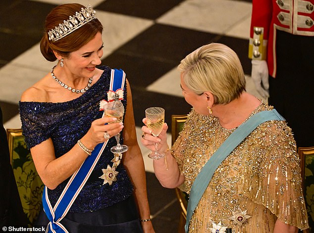 'HISTORICAL TIES AND CLOSE RELATIONS': The state visit was held to strengthen and promote ties between the two countries, and Queen Mary (pictured, left) and Halla Tomasdottir (pictured, right) appeared friendly while they smiled at each other during a toast.