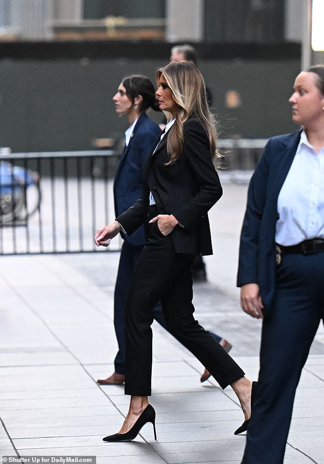 Former first lady Melania Trump leaves Fox News headquarters in Manhattan after her interview on The Five while promoting her new memoir Melania. The former first lady was flanked by Secret Service agents as she walked toward a van.