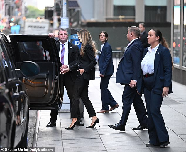 Former first lady Melania Trump surrounded by Secret Service agents as she leaves Fox News on October 8 in New York City.