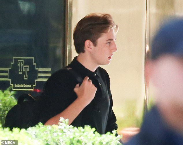 Barron Trump, 18, leaves Trump Tower in New York City as he heads to New York University, where he is a freshman.