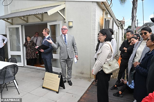 The family home, or someone's main place of residence, has been exempt from capital gains tax since it was introduced in September 1985 (pictured, an auction in Sydney).