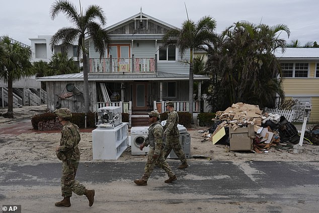 Members of the Florida Army National Guard check for remaining residents in nearly deserted Bradenton Beach on Oct. 8.