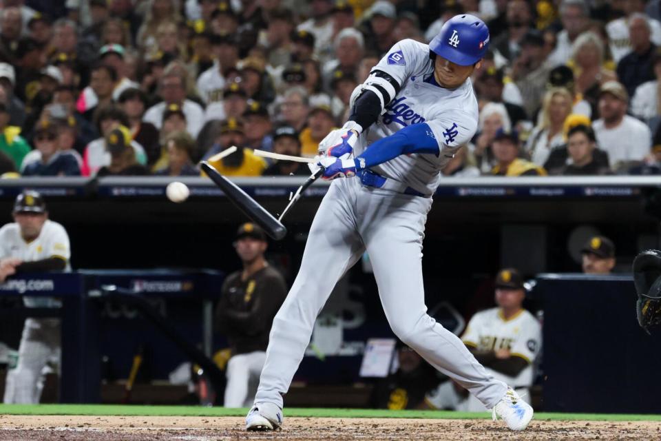 Shohei Ohtani breaks his bat with a single during the third inning of Game 3 of the NLDS on Tuesday.