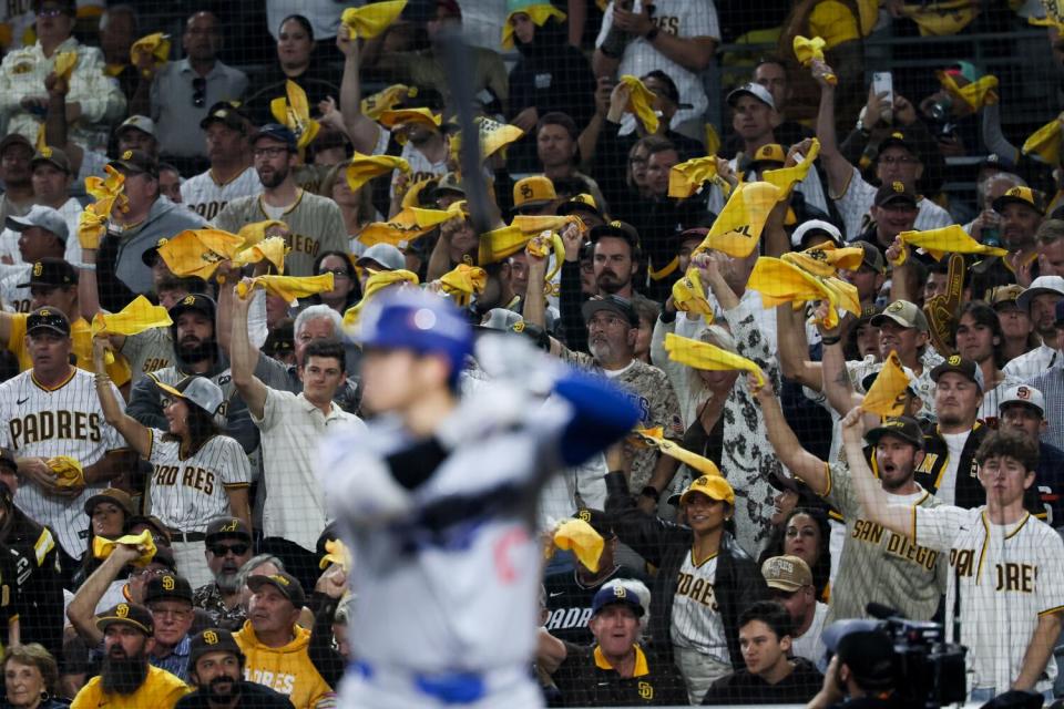 San Diego Padres fans applaud as Shohei Ohtani bats in the eighth inning of the Dodgers' 6-5 loss.