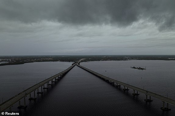 FILE PHOTO: A drone view shows storm clouds over the Caloosahatchee River as Hurricane Milton approaches Fort Myers, Florida, U.S., October 8, 2024. REUTERS/Ricardo Arduengo/File Photo