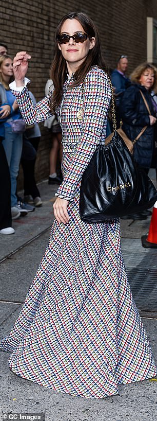 Riley looked chic in a cropped fitted plaid cardigan, with a matching maxi skirt, adding a large Chanel bag and vintage-inspired sunglasses.