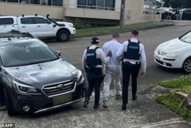 According to his LinkedIn page, Keenan Mickley became an NRL agent just under a year ago (pictured, AFP agents arresting one of the two)