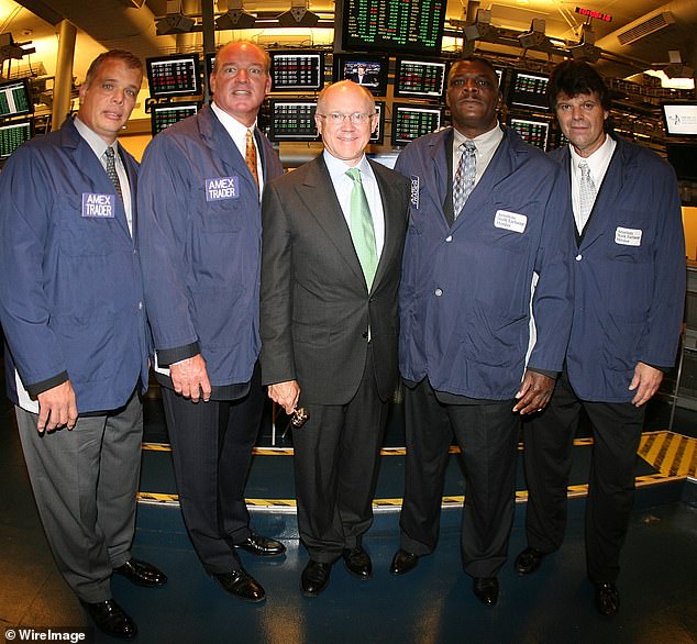 Joe Klecko, Marty Lyons, Abdul Salaam and Mark Gastineau, known collectively as the famous New York Jets "Bag exchange" Working on the floor of the American Stock Exchange after the opening bell to help kick off the next National Football League season on August 29, 2007.