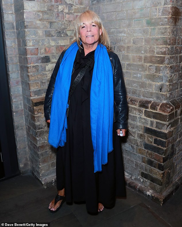 Linda Robson wore a black dress, a black leather jacket and a bright blue scarf.