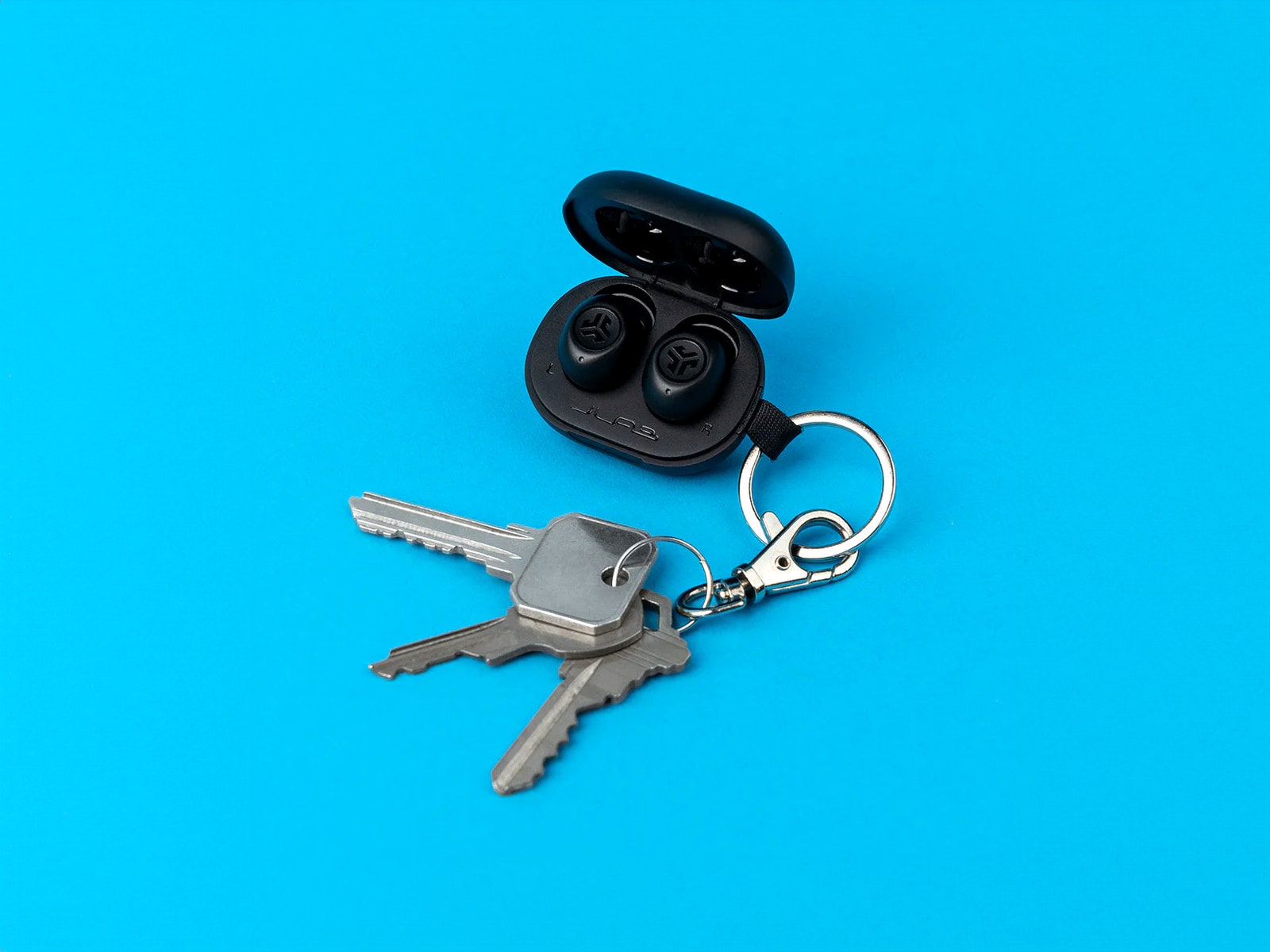 JLab JBud mini headphones attached to a keychain