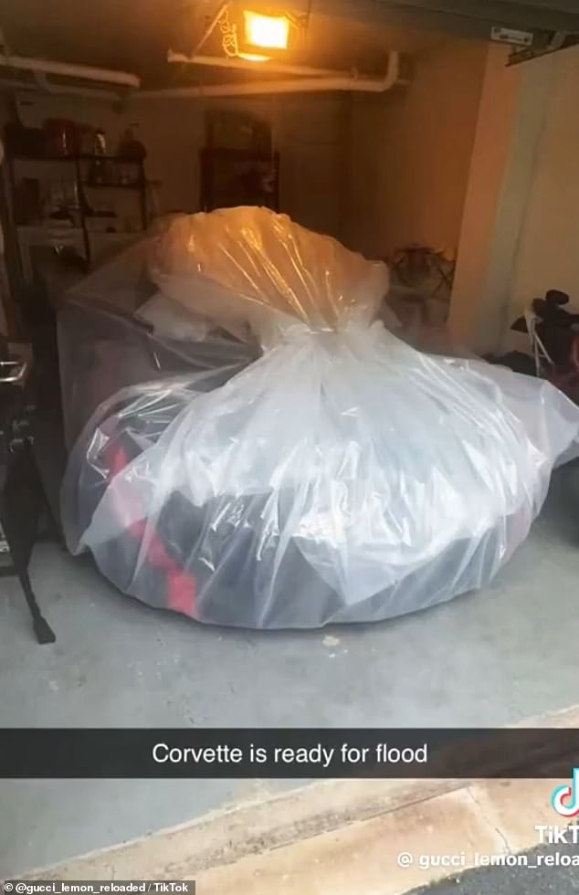 After covering the garage with plastic, he went back and put a cover on it, before wrapping the vehicle in plastic.