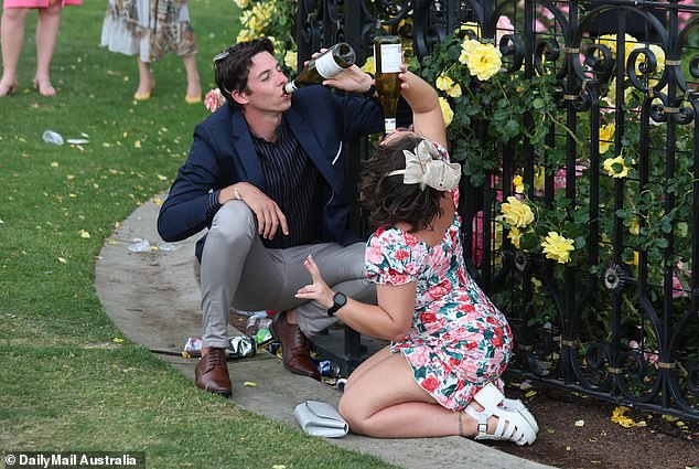 The off-track action at the Cup is an even bigger draw for some than the running of the event itself (pictured, racegoers at Flemington in 2023)