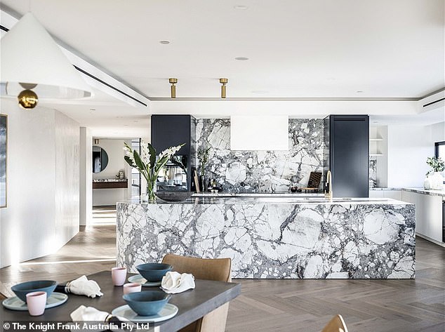 Located on the 40th floor of the luxury apartment block, the penthouse features a private lobby and Brazilian marble, French oak herringbone parquet, custom lighting and brass and leather accents. In the photo: the beautiful kitchen.