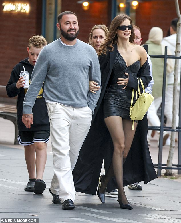 Barbara opted for a pair of opaque tights with the look and wore a pair of statement sunglasses. Later, he looked in good spirits when he was joined by his friend and stylist Owen Gould (pictured left).