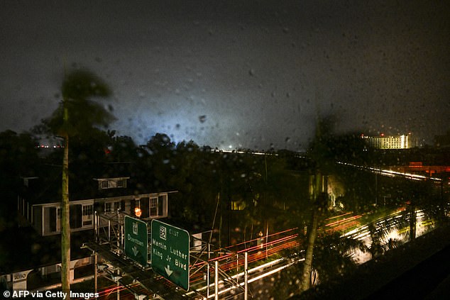 A power transformer explodes, creating a backlight, as Hurricane Milton makes landfall in Fort Myers, Florida.