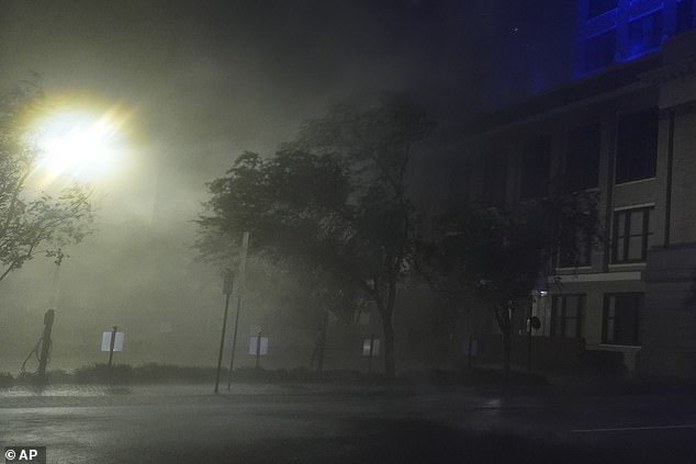 Wind-driven rain soaks a street in downtown Tampa, Florida, as Hurricane Milton passes.