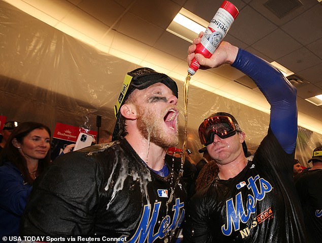 Mets 1B Pete Alonso (right) and OF Harrison Bader celebrate in the locker room