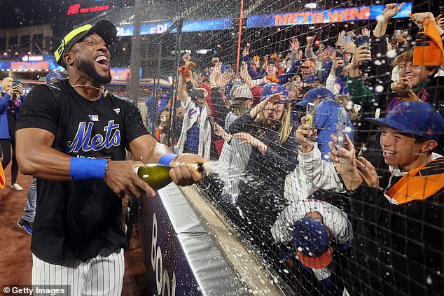 Starling Marte sprays champagne into stands after Mets beat Phillies