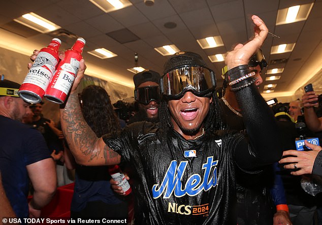 Mets shortstop Luisangel Acuña (2) celebrates in the clubhouse after defeating the Phillies