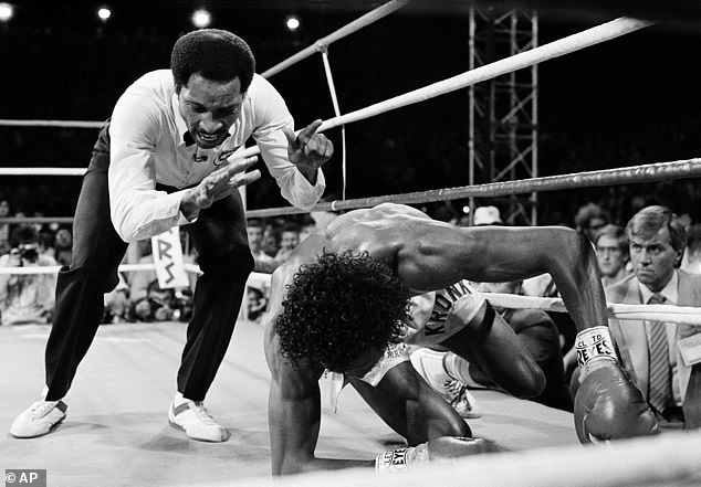 Hearns struggles to his feet after being brutally knocked out in the third round by Hagler.