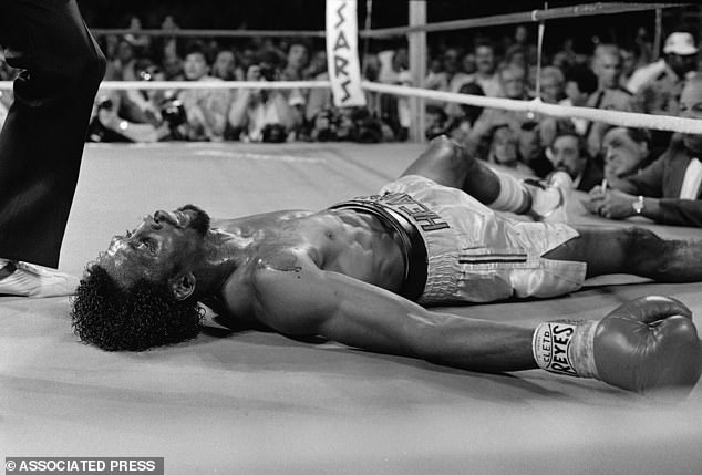 Hearns lies soaked in his own blood on the canvas in the third round before the fight ends.