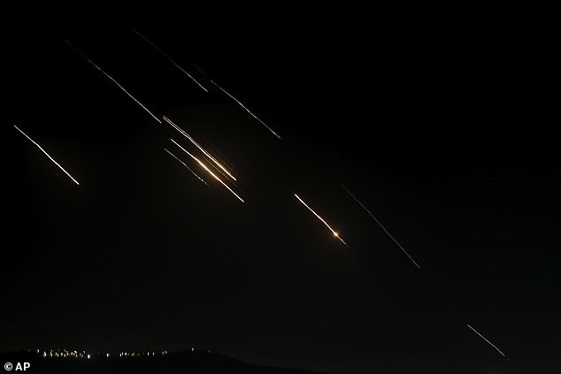 Missiles launched from Iran toward Israel are seen in the West Bank city of Nablus, Tuesday, Oct. 1, 2024.