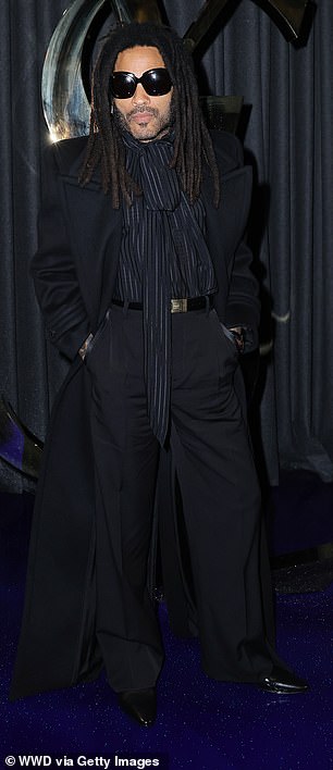 Her rock star father, 60, cut an edgy figure in a large black trench coat that featured exaggerated padded shoulders.