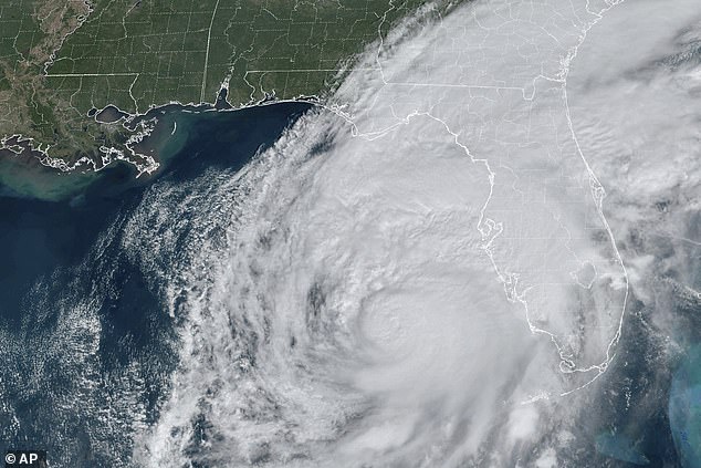 A satellite image shows Hurricane Milton swirling in the Gulf of Mexico approaching Florida.